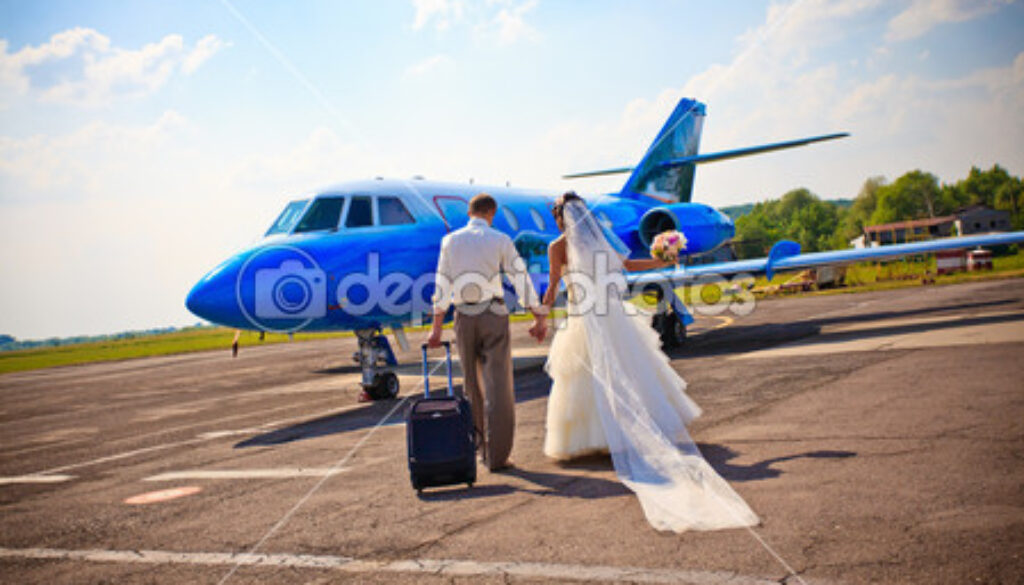 depositphotos_6056056-Wedding-couple-fly-on-honeymoon.jpg
