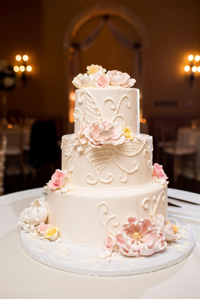Full-service wedding planning with pink and white wedding cake 
