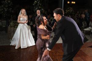 mother and groom dancing