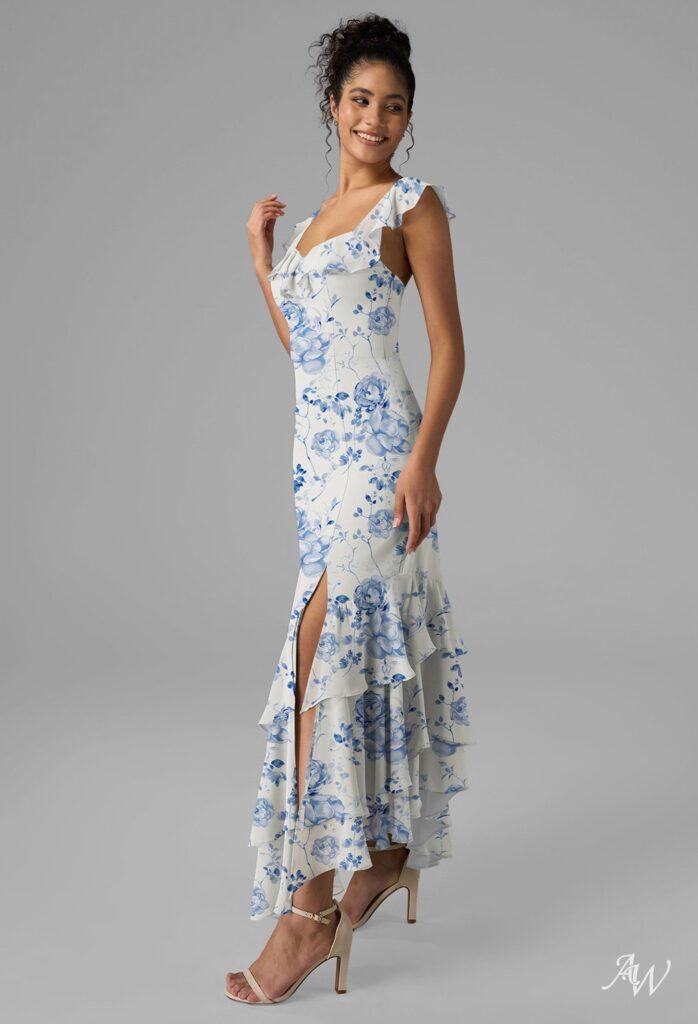 women in blue floral wedding guest dress