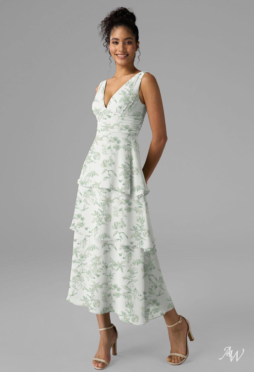 women in green floral wedding guest dress