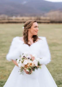 white winter weather dress styles bride in shawl 