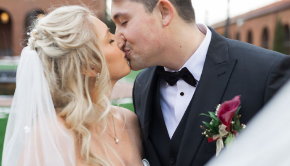 bride and groom kissing