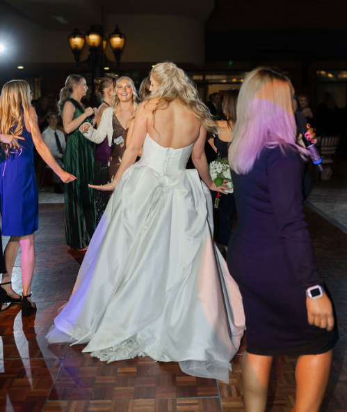 bride and friends dancing